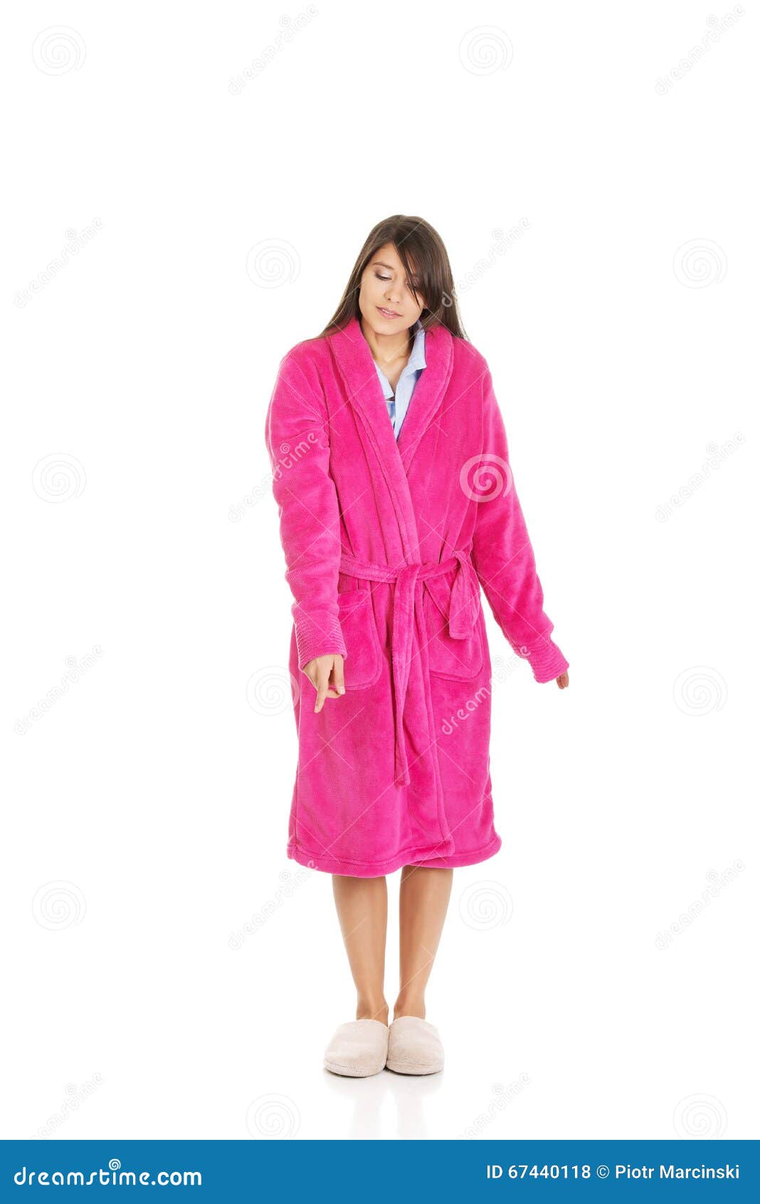 Woman in Pink Bathrobe Pointing Down. Stock Photo Image of bodycare