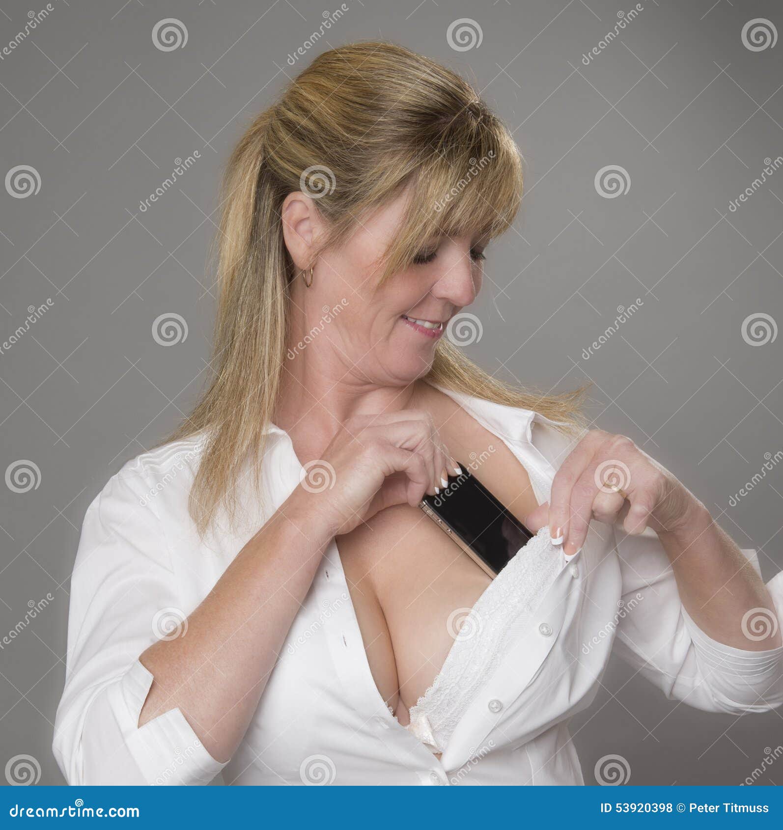 Woman Placing Phone into Her Bra Stock Photo - Image of place, electronic:  53920398