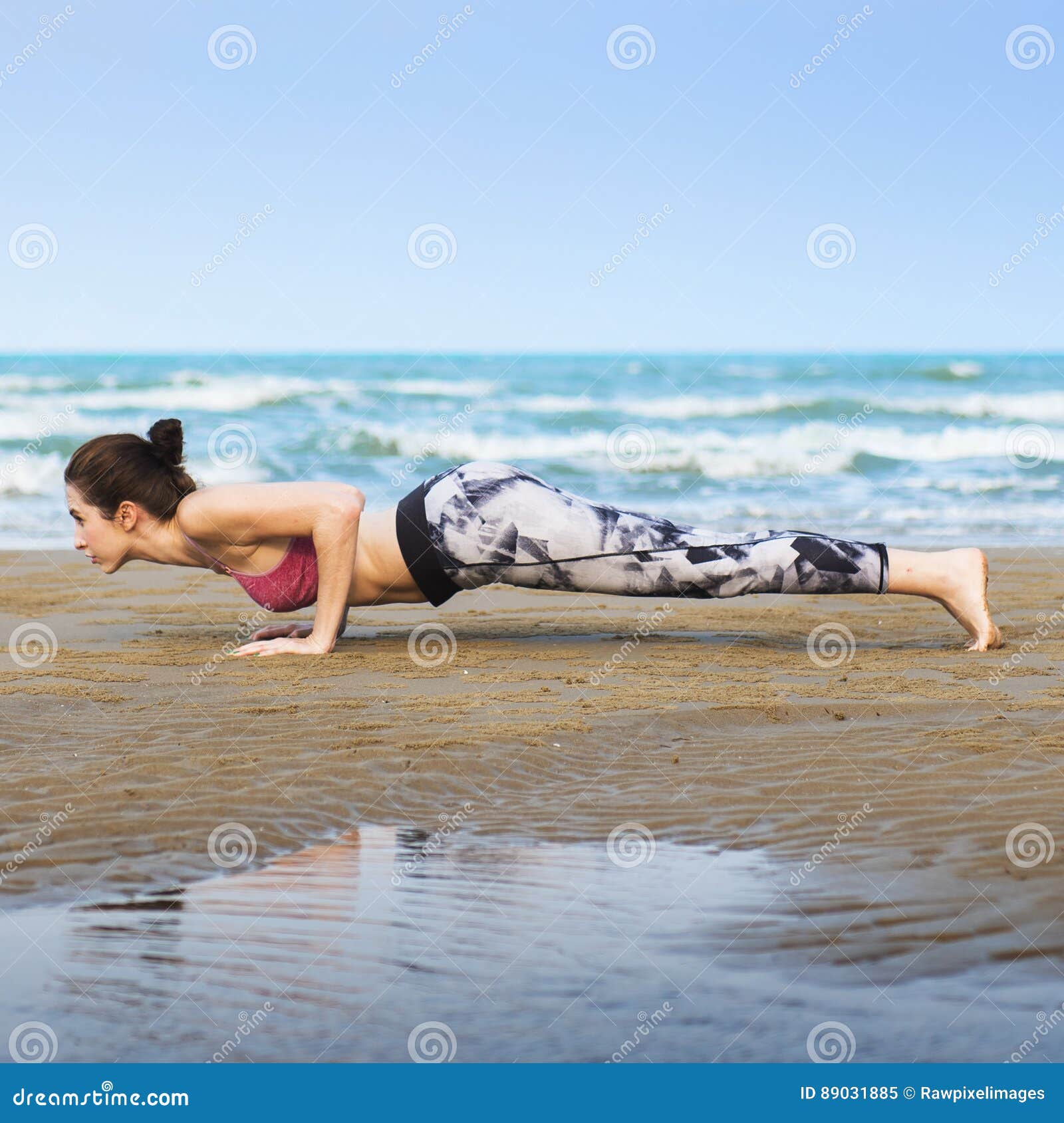 woman planking stretching flex training healthy lifestyle beach concept