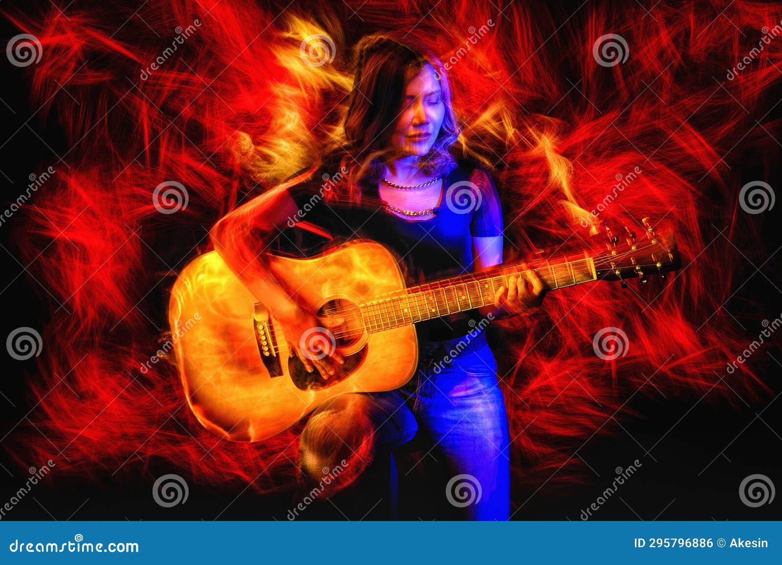 Woman Playing Guitar Surrounded by Dynamic Light Painting and Vivid