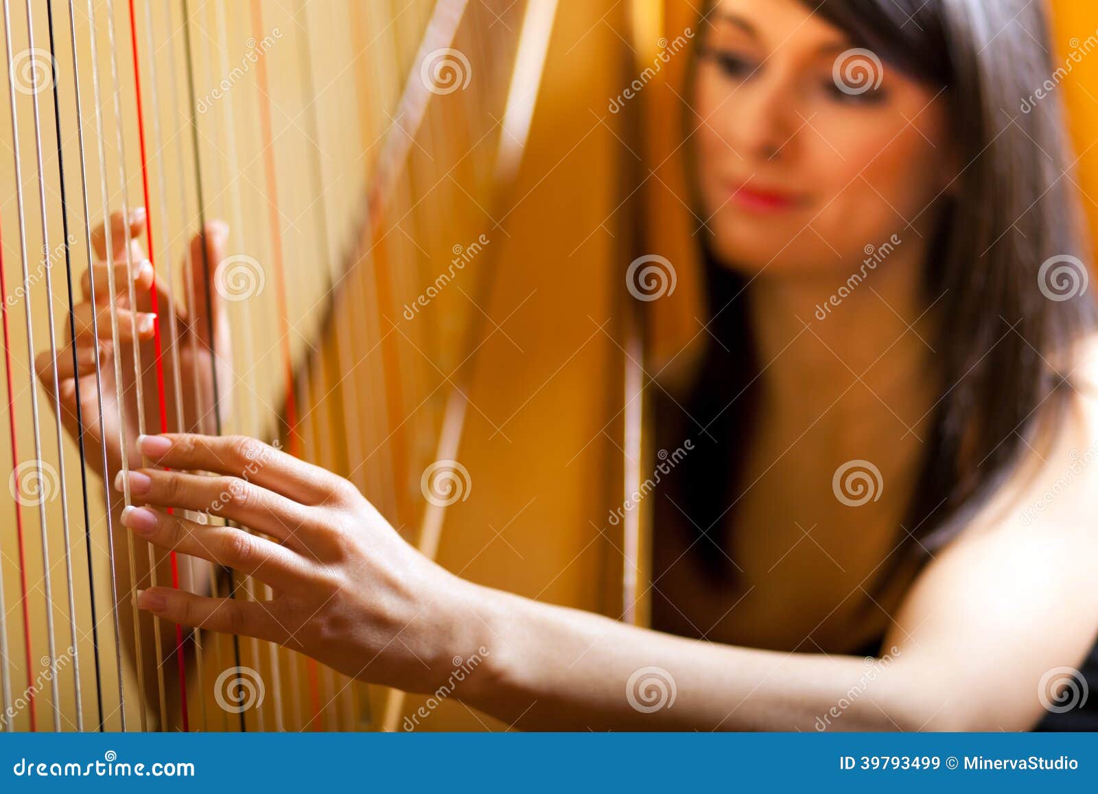 Woman playing the harp Stock Photo by ©halfpoint 51620443