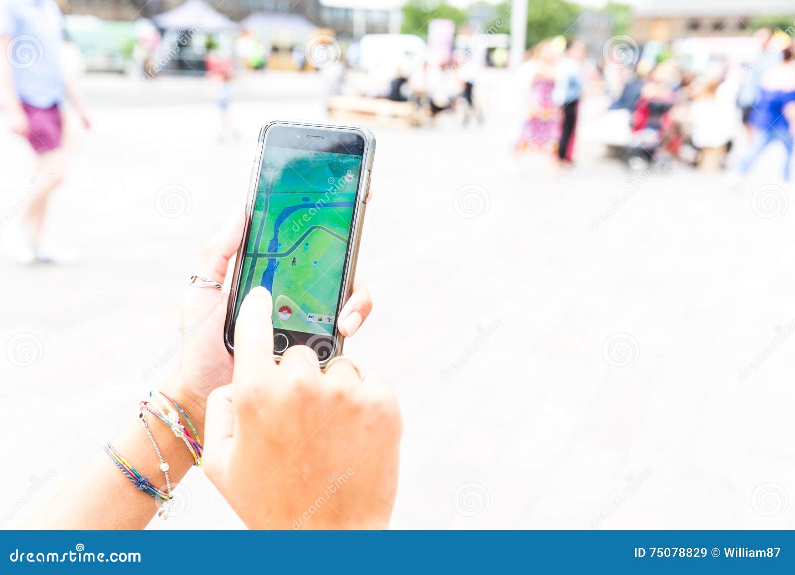 Woman sitting in a car and playing a Pokemon Go game Stock Photo - Alamy