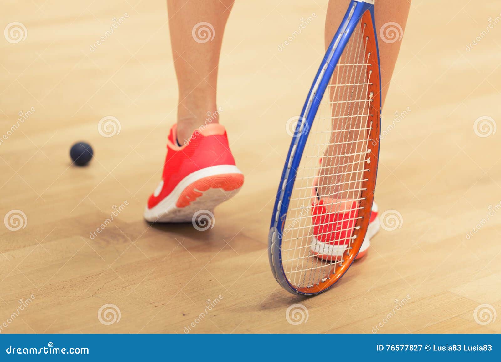 Woman playing squash stock image. Image of ball, indoors 76577827