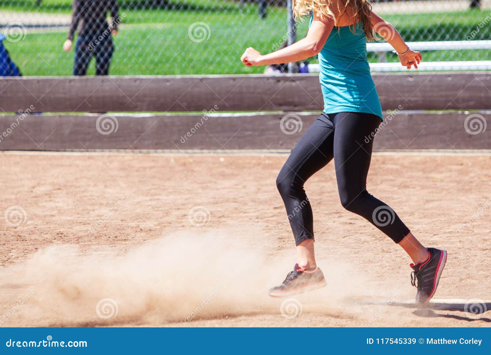 a woman plays a game of kickball