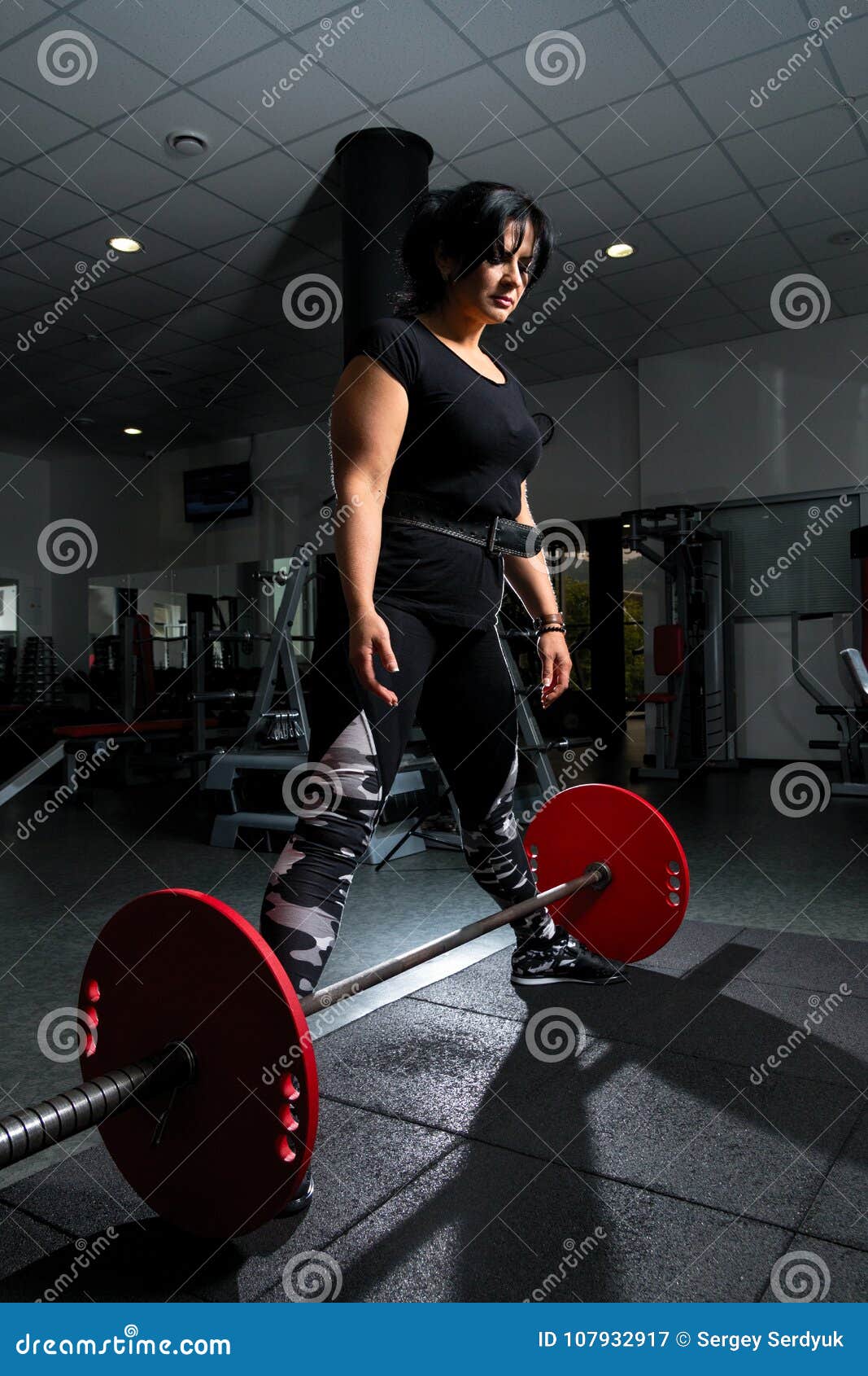 Woman Plus Size In Gym Doing Exercises With Barbell Powerlift