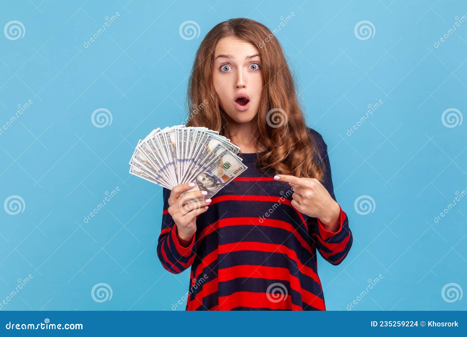 Woman Pointing at Dollars Banknotes in Her Hand, Having Astonished ...