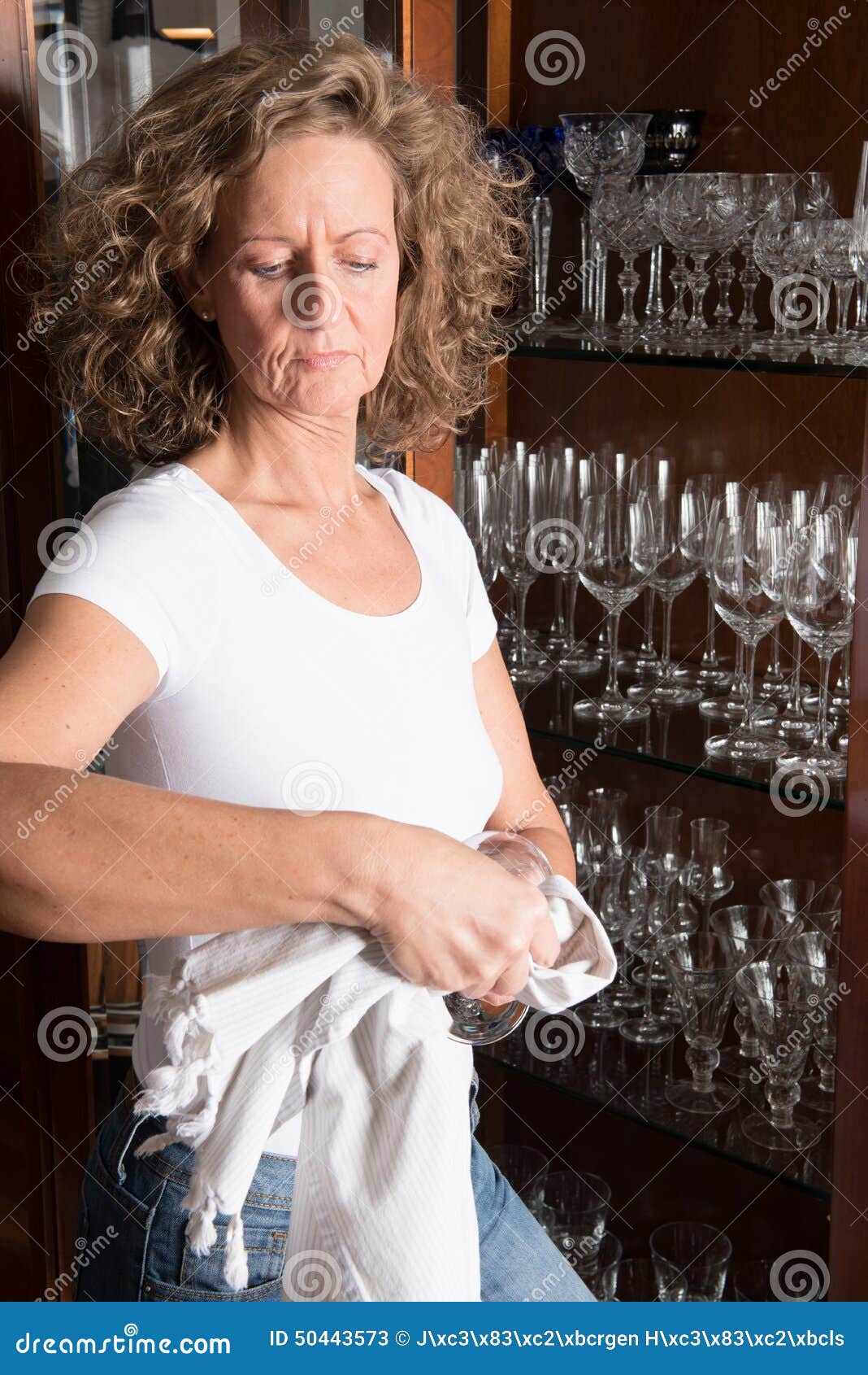 Woman polishing glasses stock image. Image of work, wrinkles 50443573