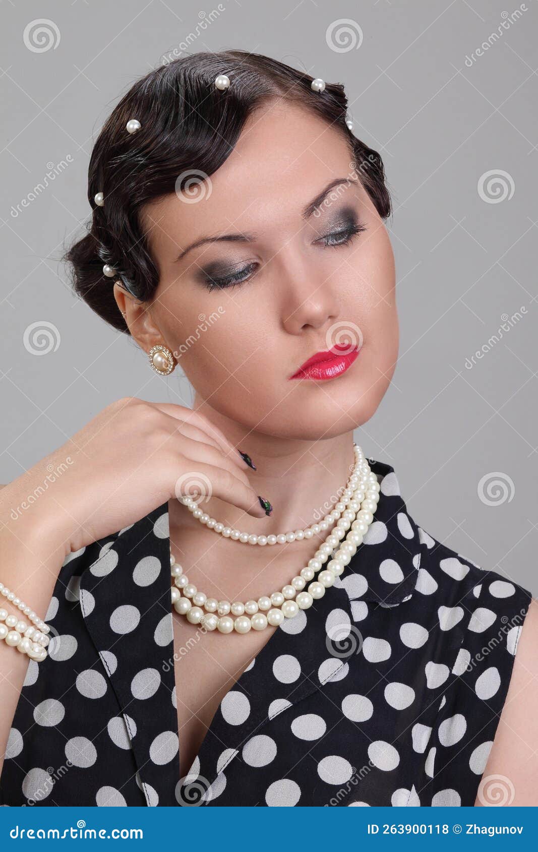 Woman in polka dot dress stock photo. Image of style - 263900118