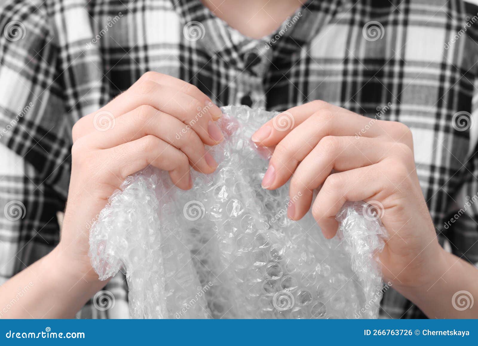 Woman Popping Bubble Wrap, Closeup. Stress Relief Stock Photo - Image