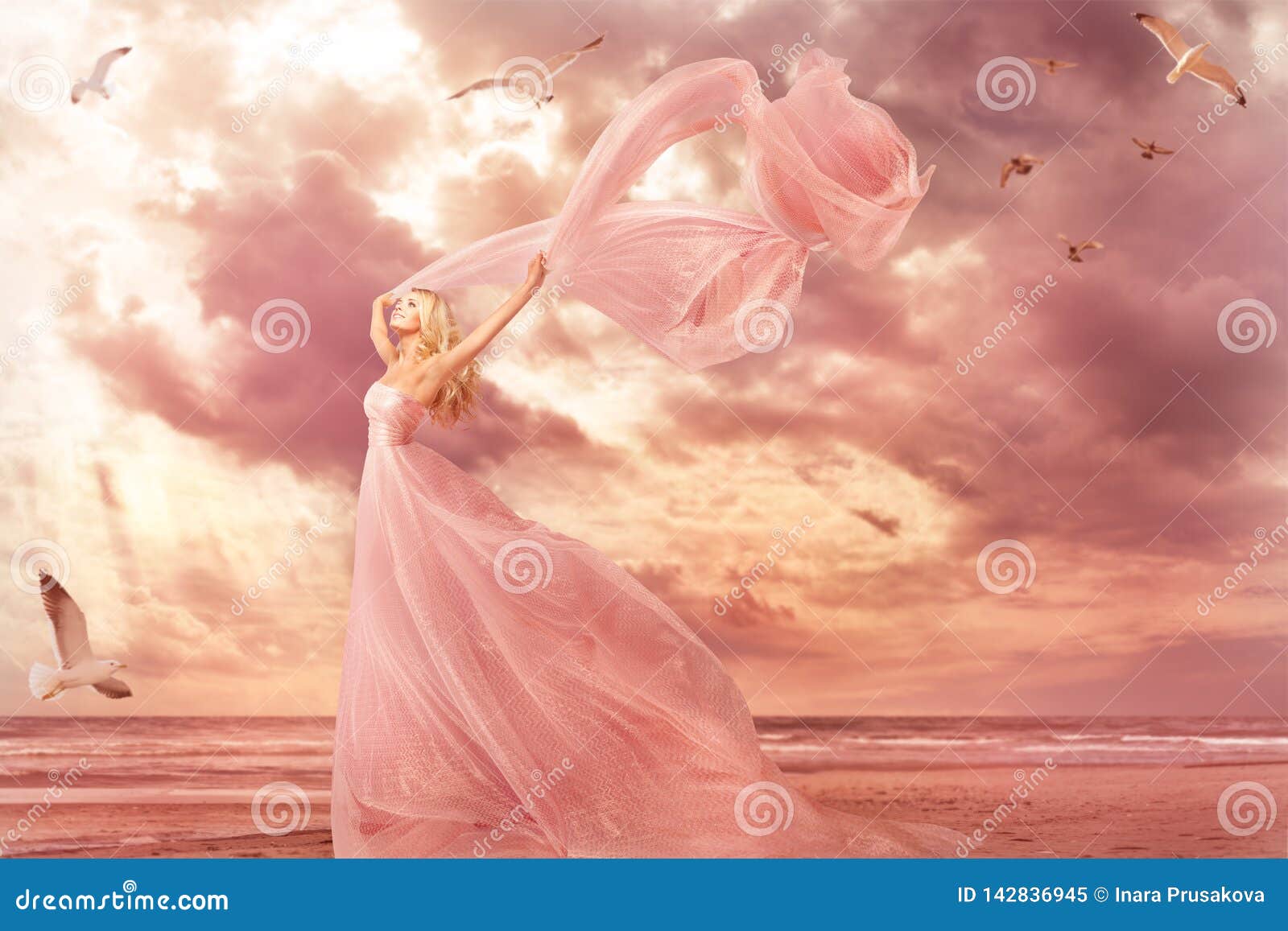 woman portrait in long dress on sea coast, fantasy girl pink gown in storm wind