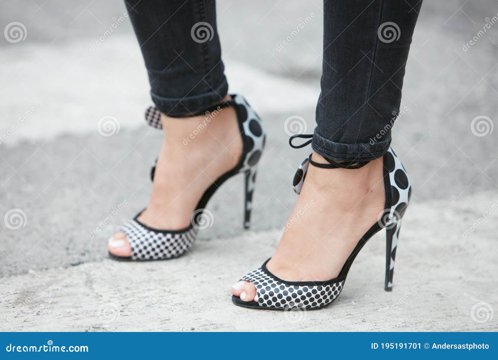 Woman Poses for Photographers with Black and White Dots High Heels ...