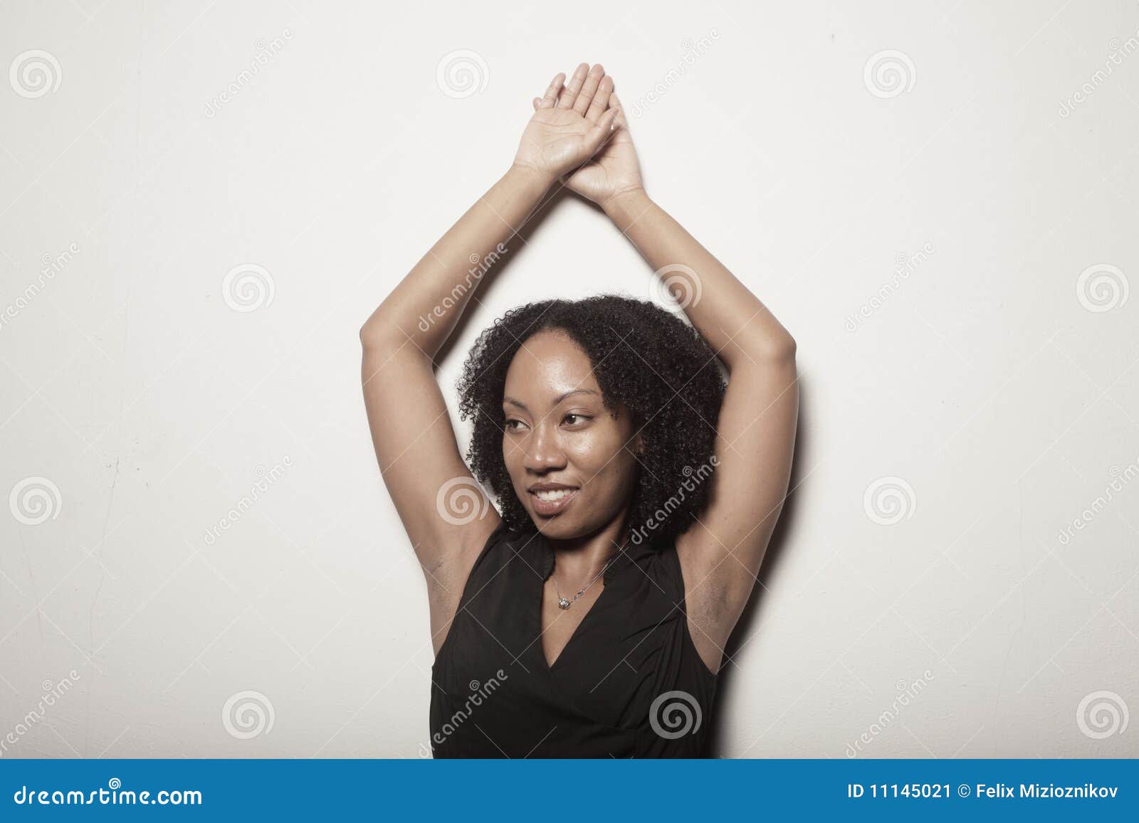 Woman Posing with Her Arms Above Her Head Stock Image - Image of