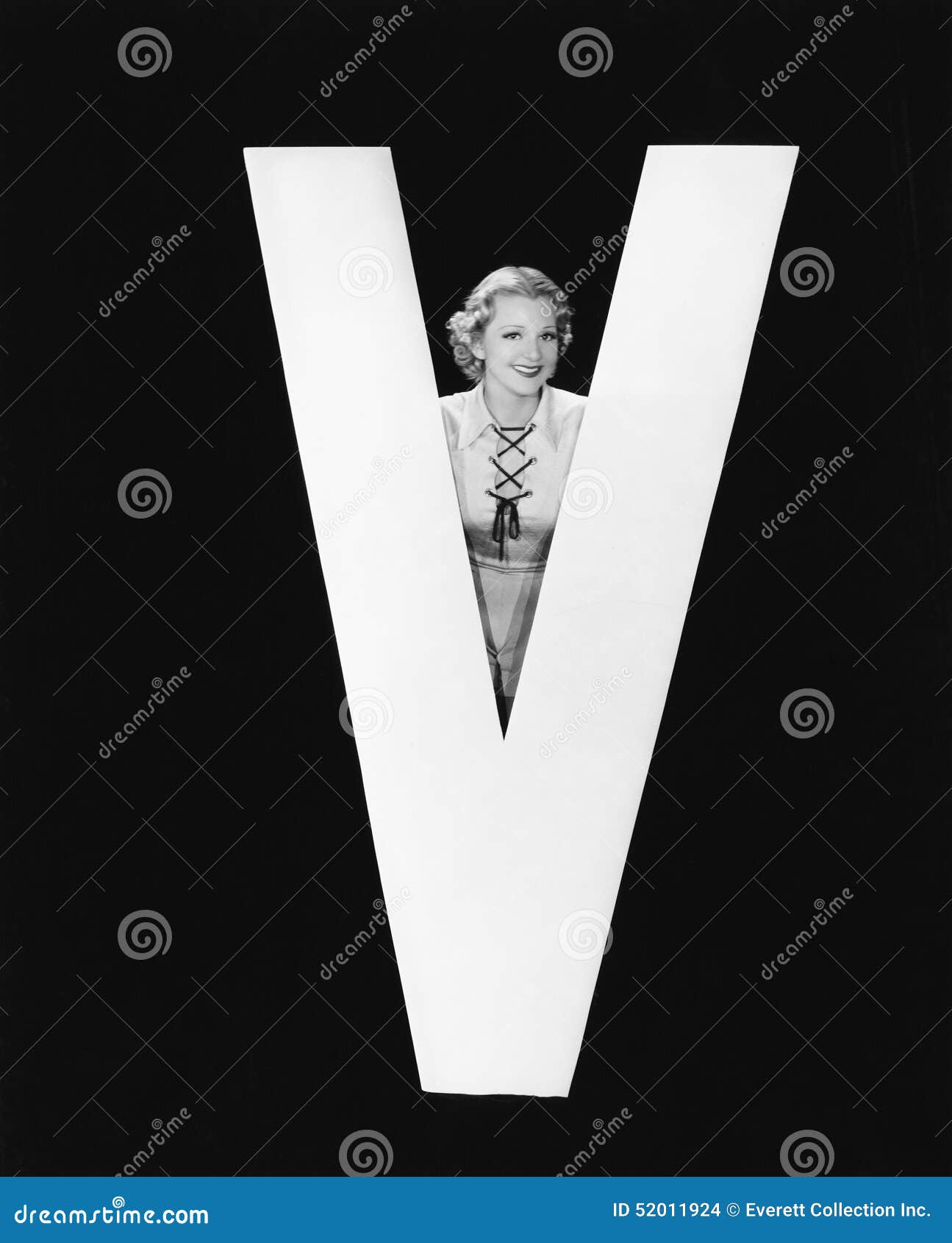 woman posing with huge letter v