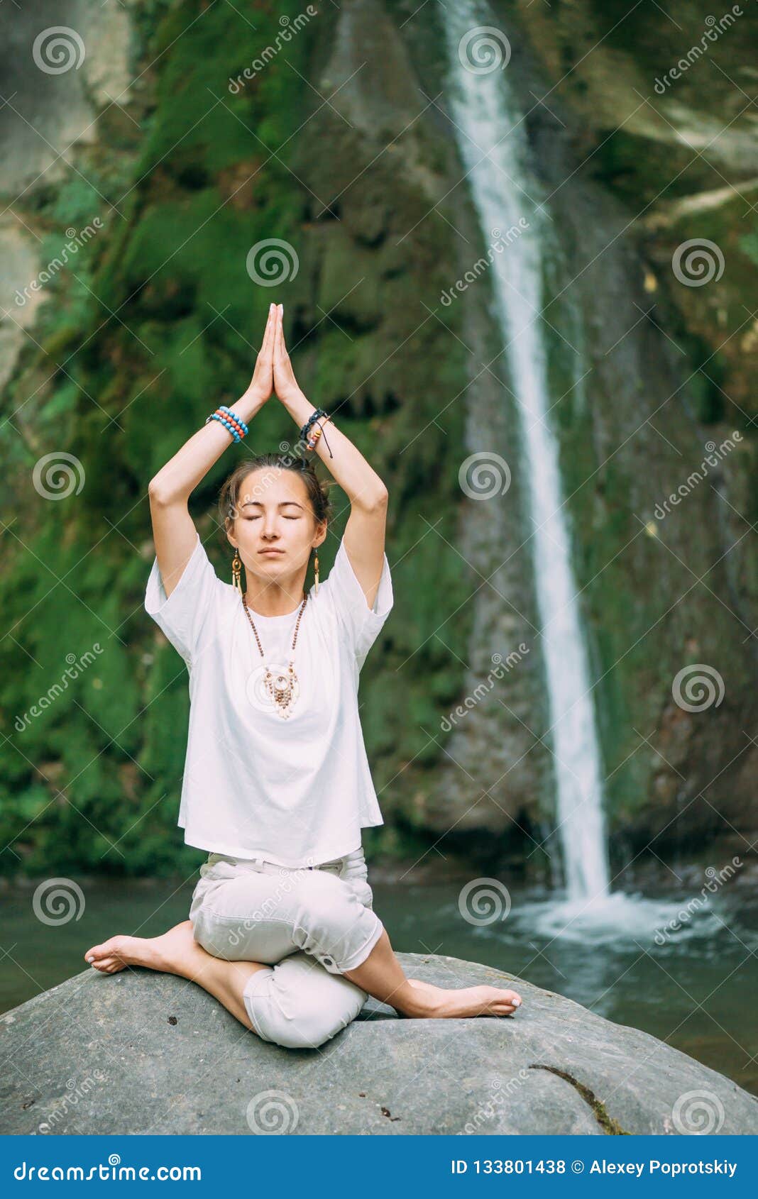 Woman Practicing Yoga Near the Waterfall. Stock Photo - Image of ...