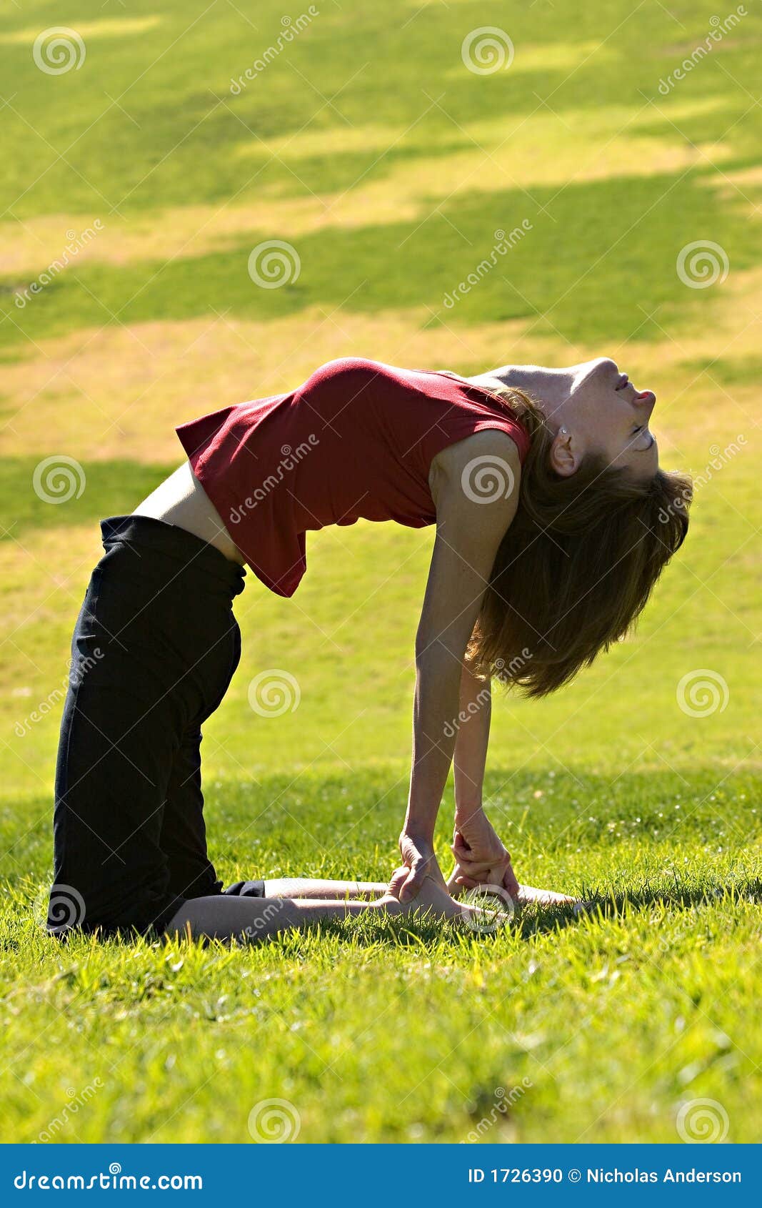 Woman practicing yoga outdoors Stock Photo by ©VelesStudio 141996326