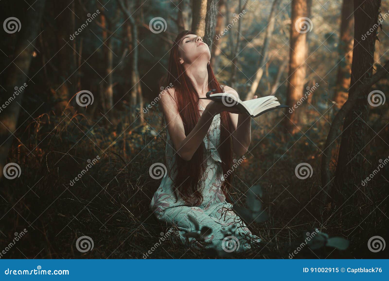 woman praying alone in the forest