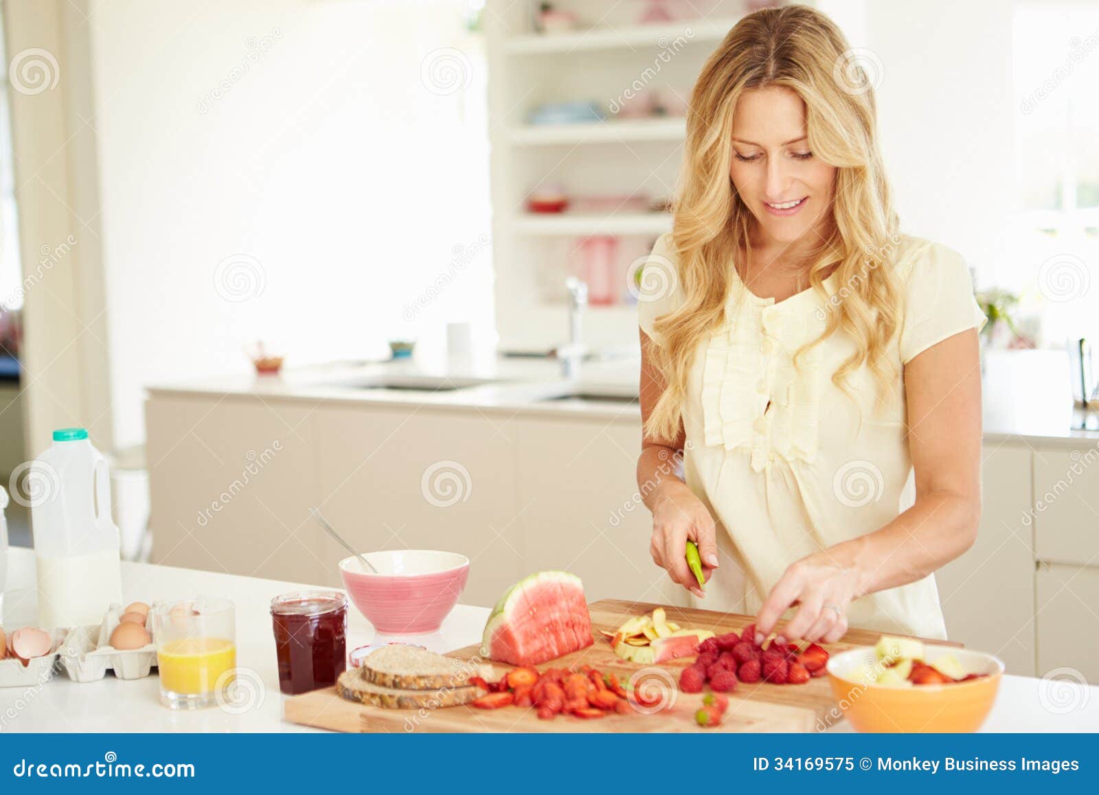 Woman Preparing Healthy Breakfast In Kitchen Royalty Free 