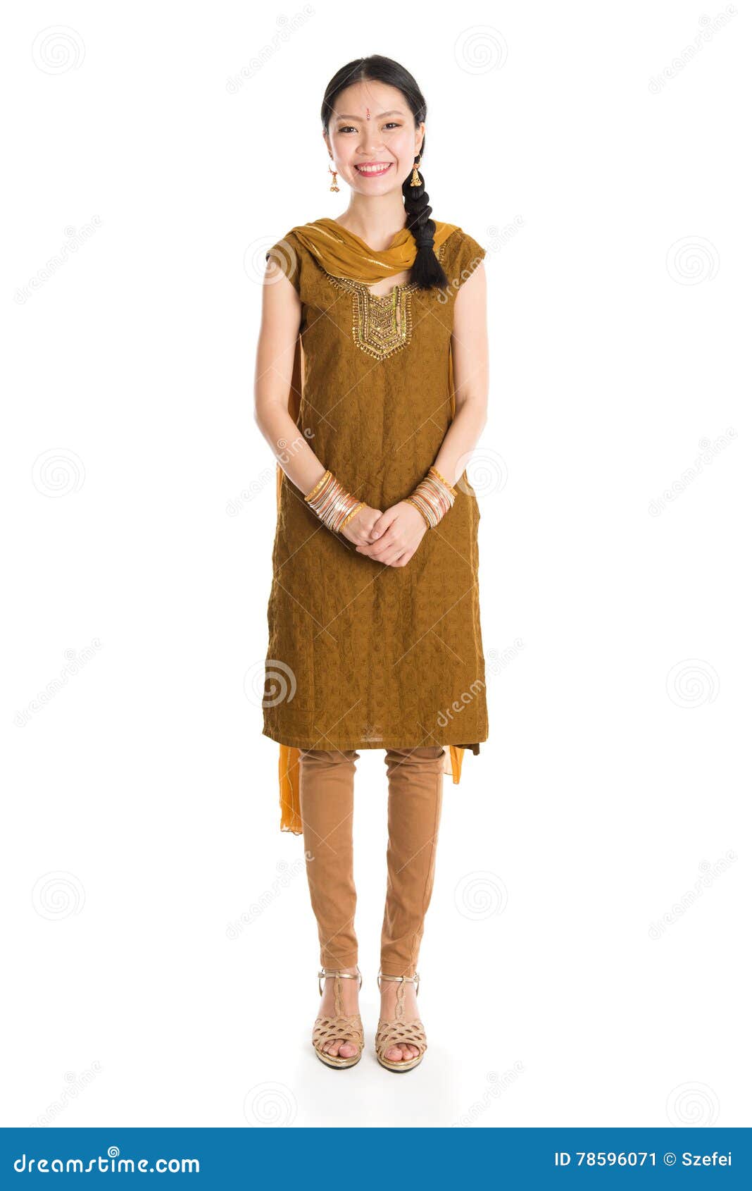 Young mixed race Indian Chinese girl in traditional punjabi dress greeting,  full length standing isolated on white background Stock Photo - Alamy