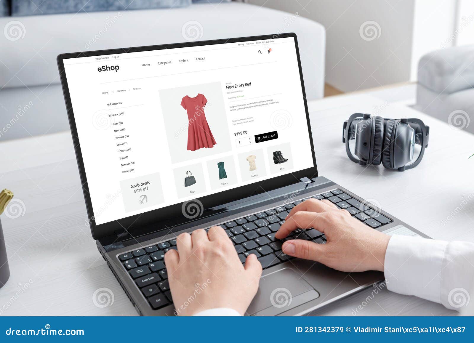 woman purchasing a stunning red dress online with laptop computer
