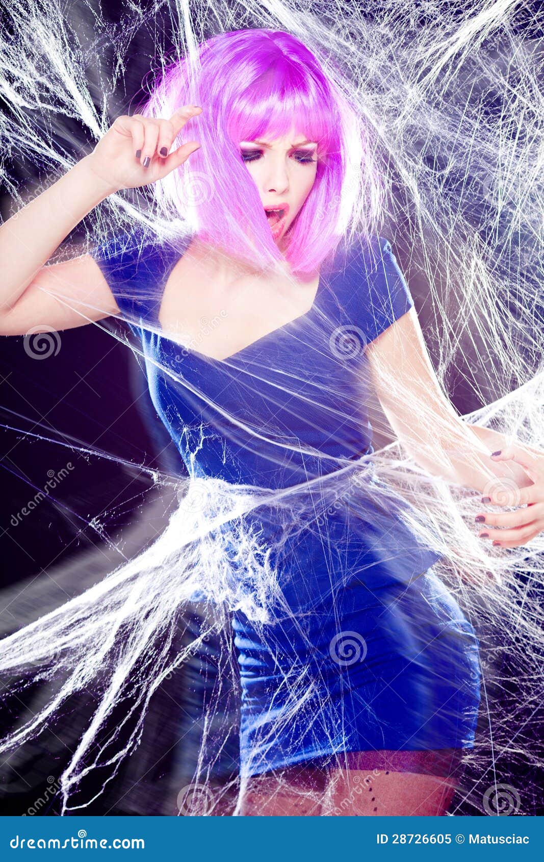 Woman With Purple Wig And Intense Make Up Trapped In A Spider Web Screaming Royalty Free Stock