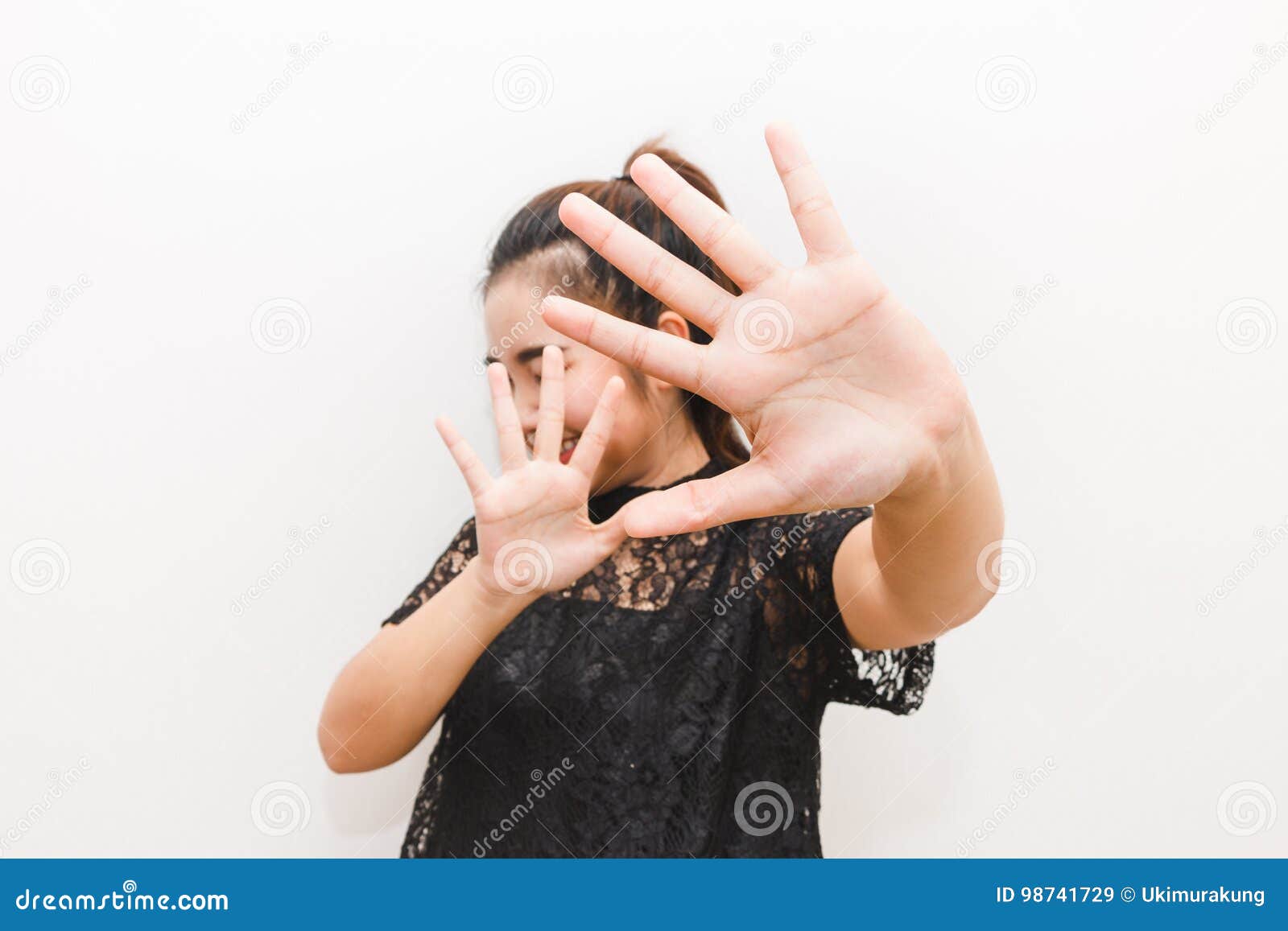 The Woman Put Her Hands Up In Defense Afraid Of Something Stock Image