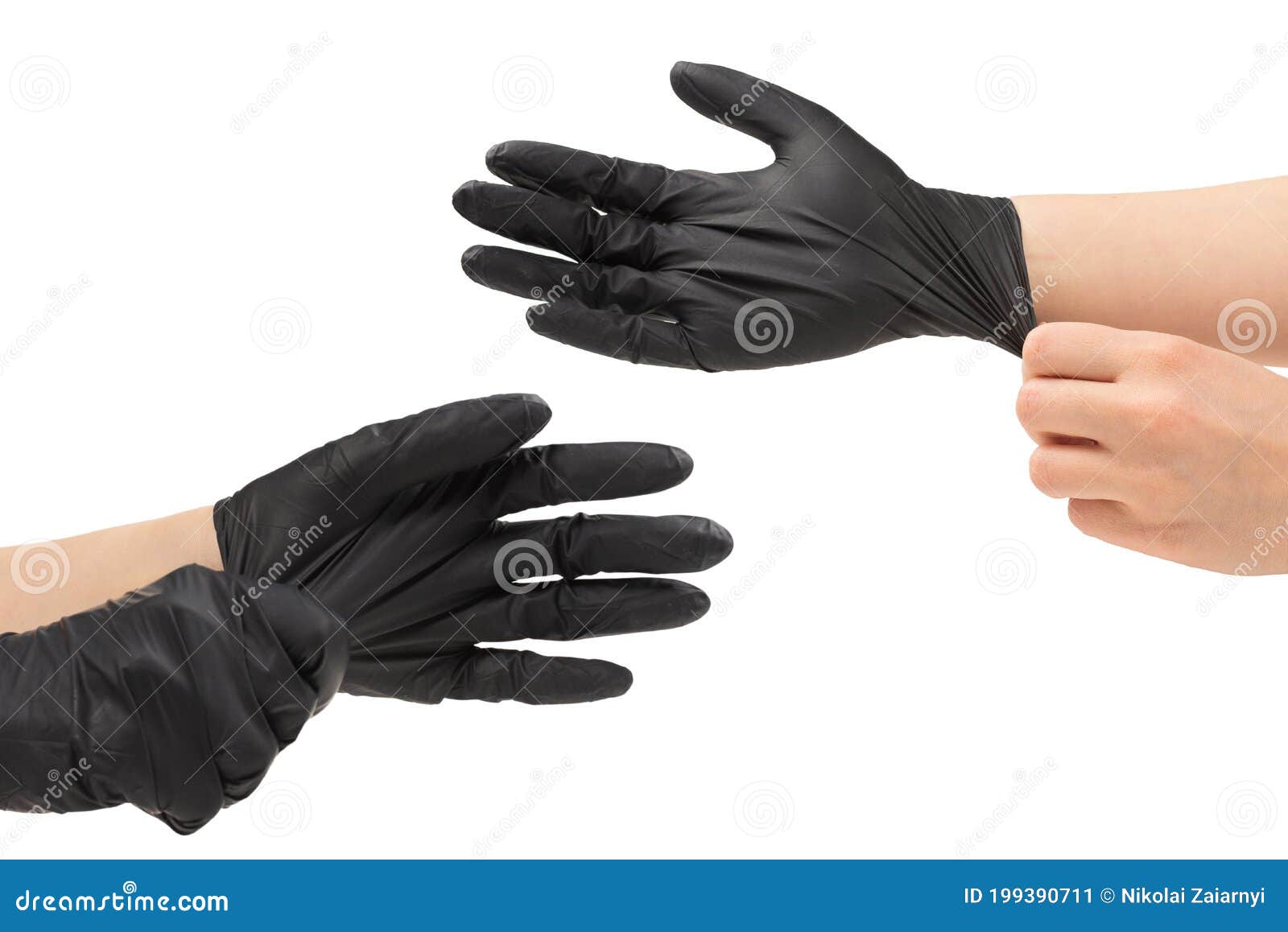 woman puts on black rubber gloves