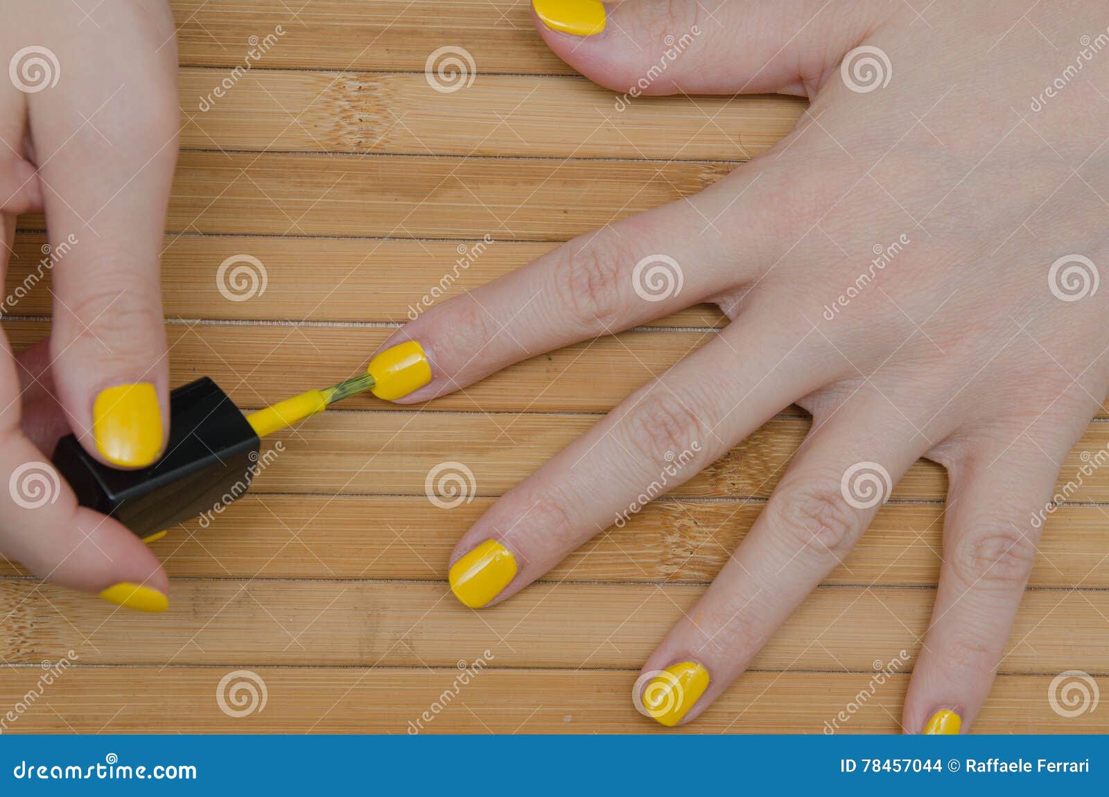 Woman Puts Yellow Nails Polish Stock Photo Image of female