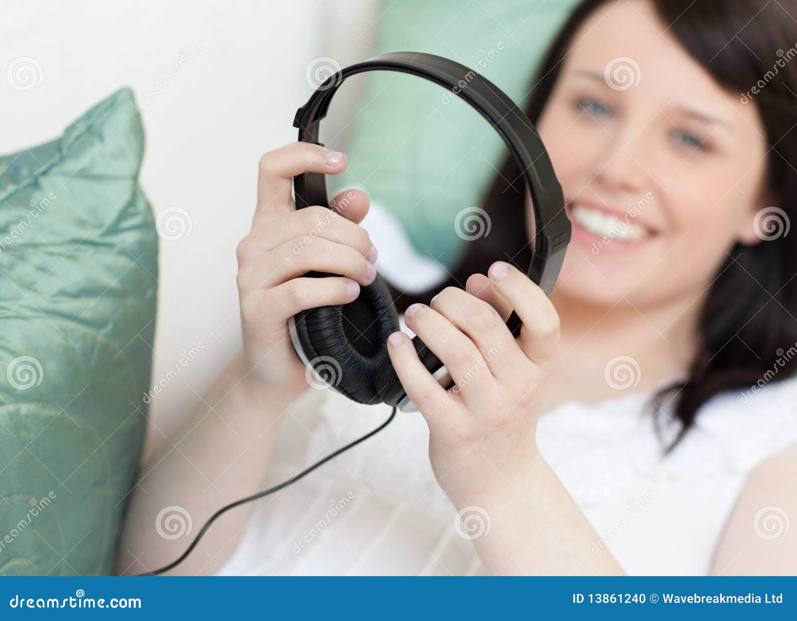 Woman Putting Headphones Lying on a Sofa Stock Photo Image of relax