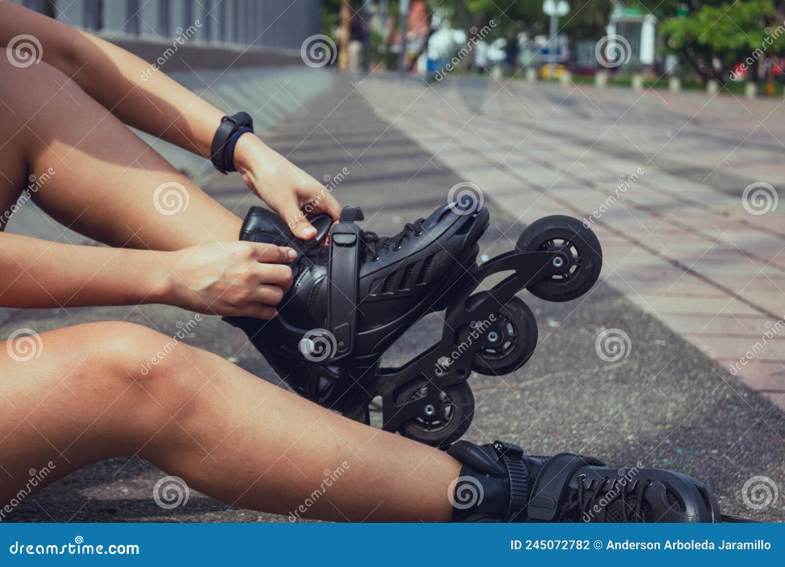 woman putting on the skates to start skating