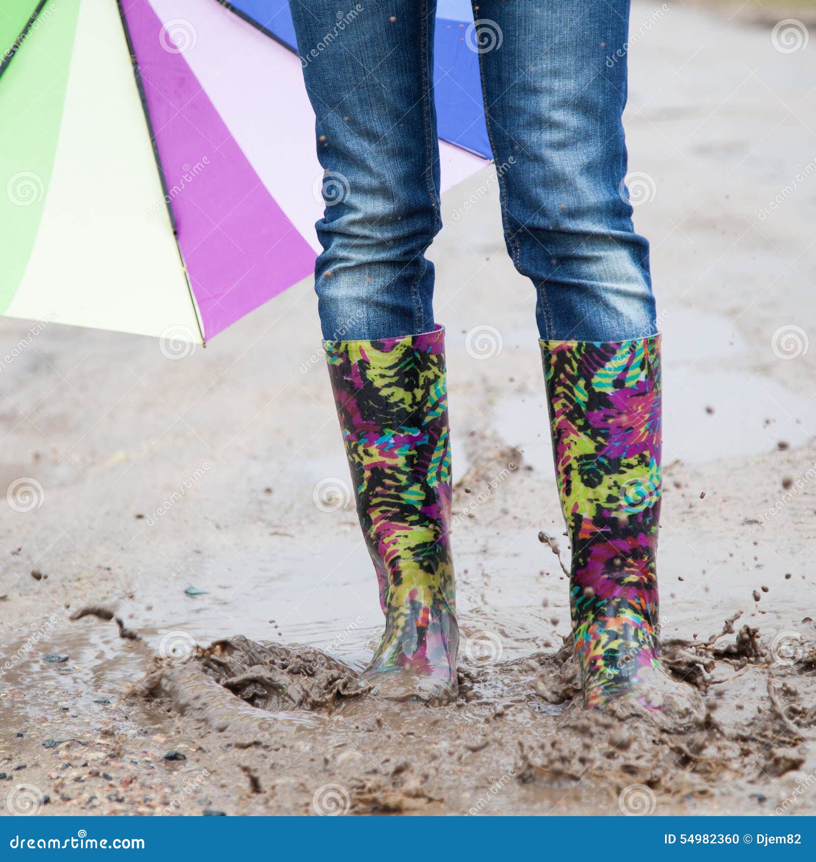 Woman with Rain Boots Jumps Stock Photo - Image of puddle, nature: 54982360