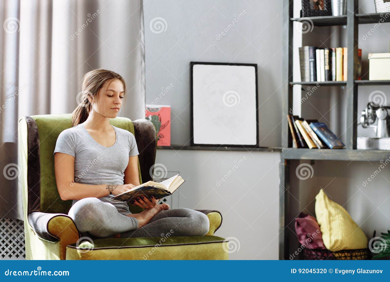 Woman Reading In Luxury Living Room