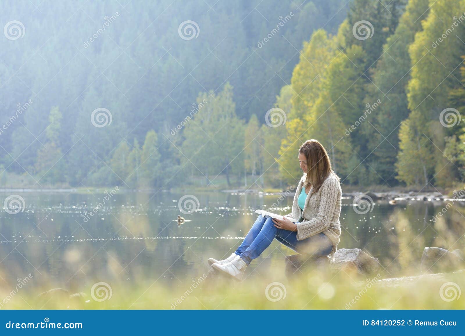 Woman reading a book outdoor.