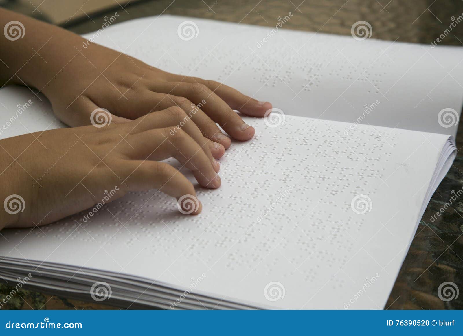 woman reading braille book
