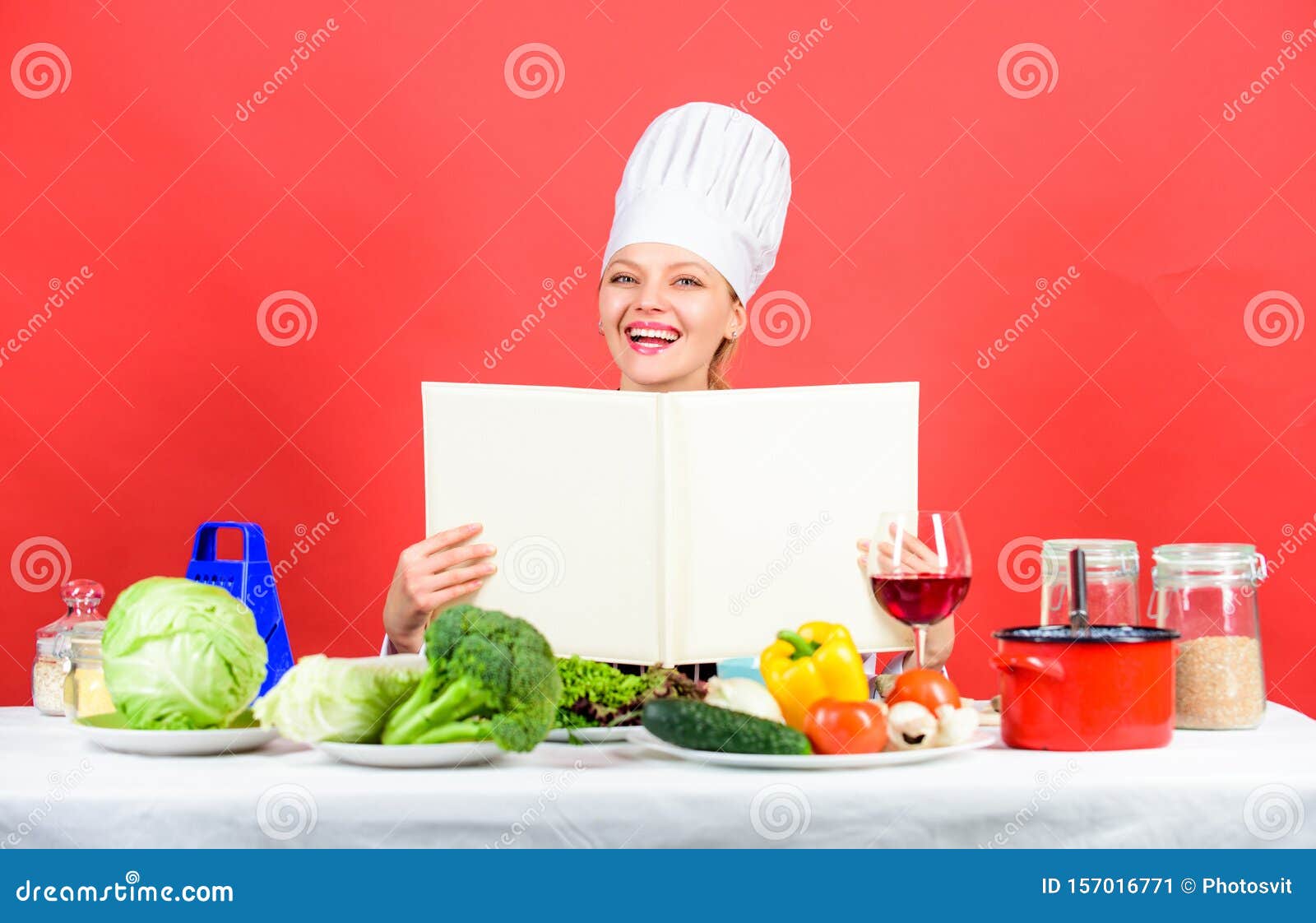 Woman Reading Cook Book in Kitchen. Girl Cook at Kitchen Table ...