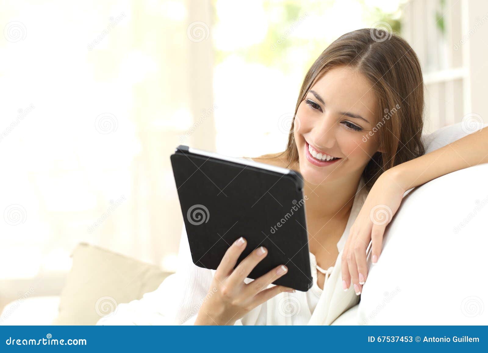 woman reading ebook at home