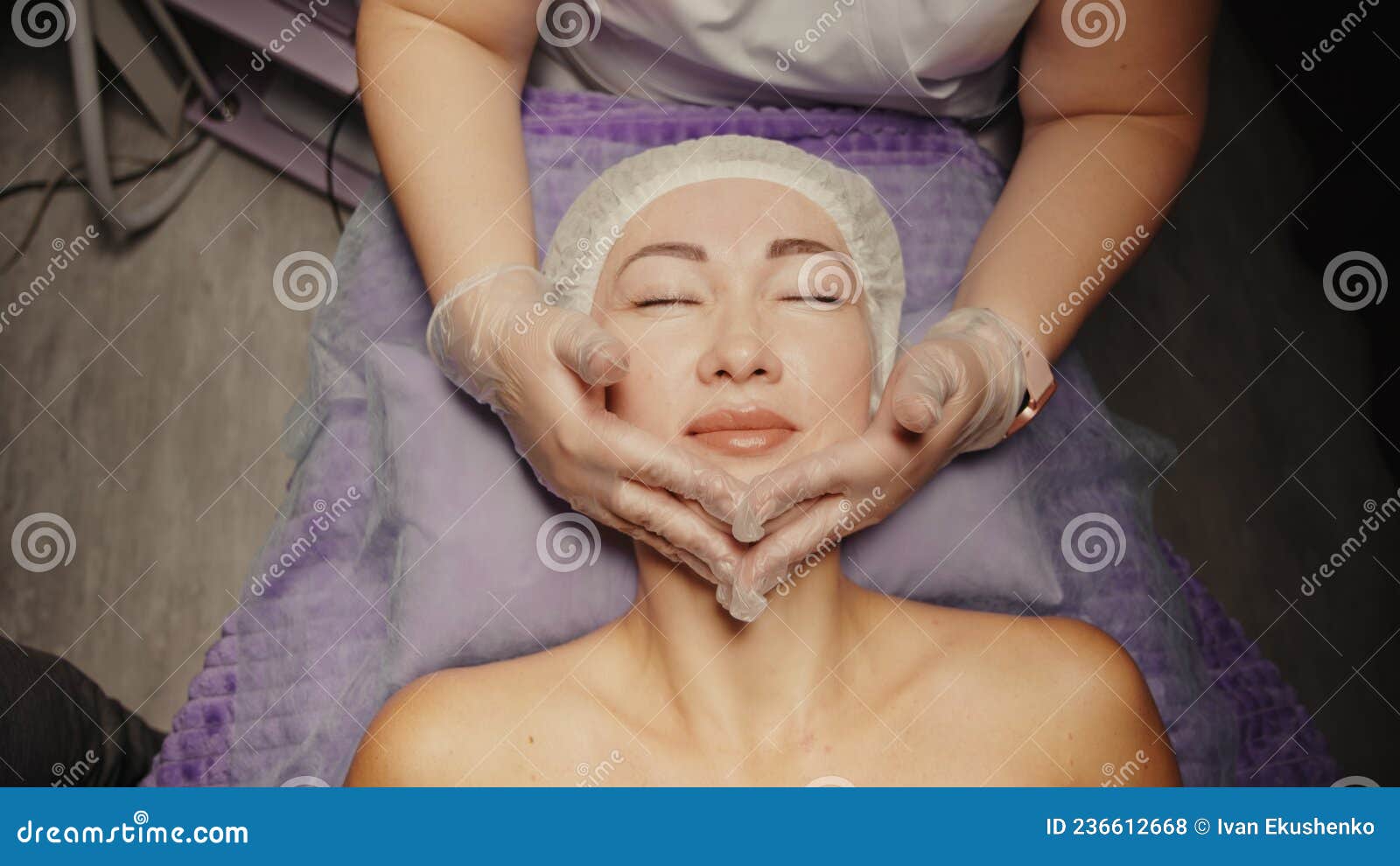 Woman Receiving Facial Massage In Spa Salon On Massage Table Wellness Body And Skin Care Face