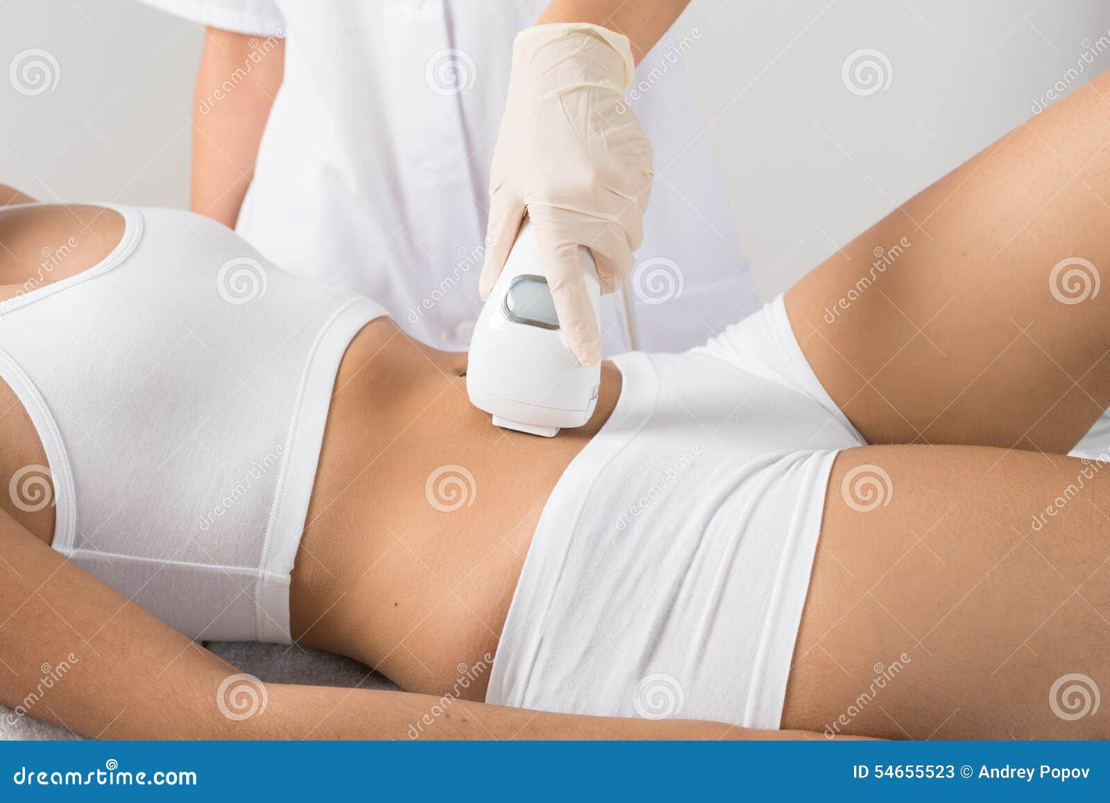 woman receiving laser treatment on belly