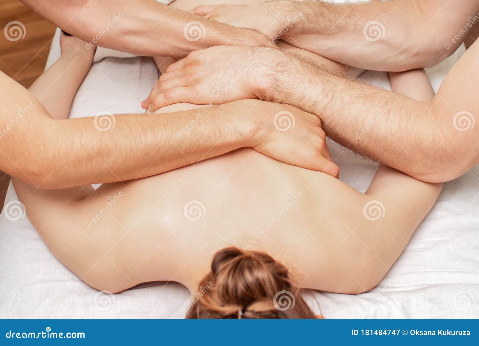 Woman Receiving Massage in Four Hands Stock Image pic photo