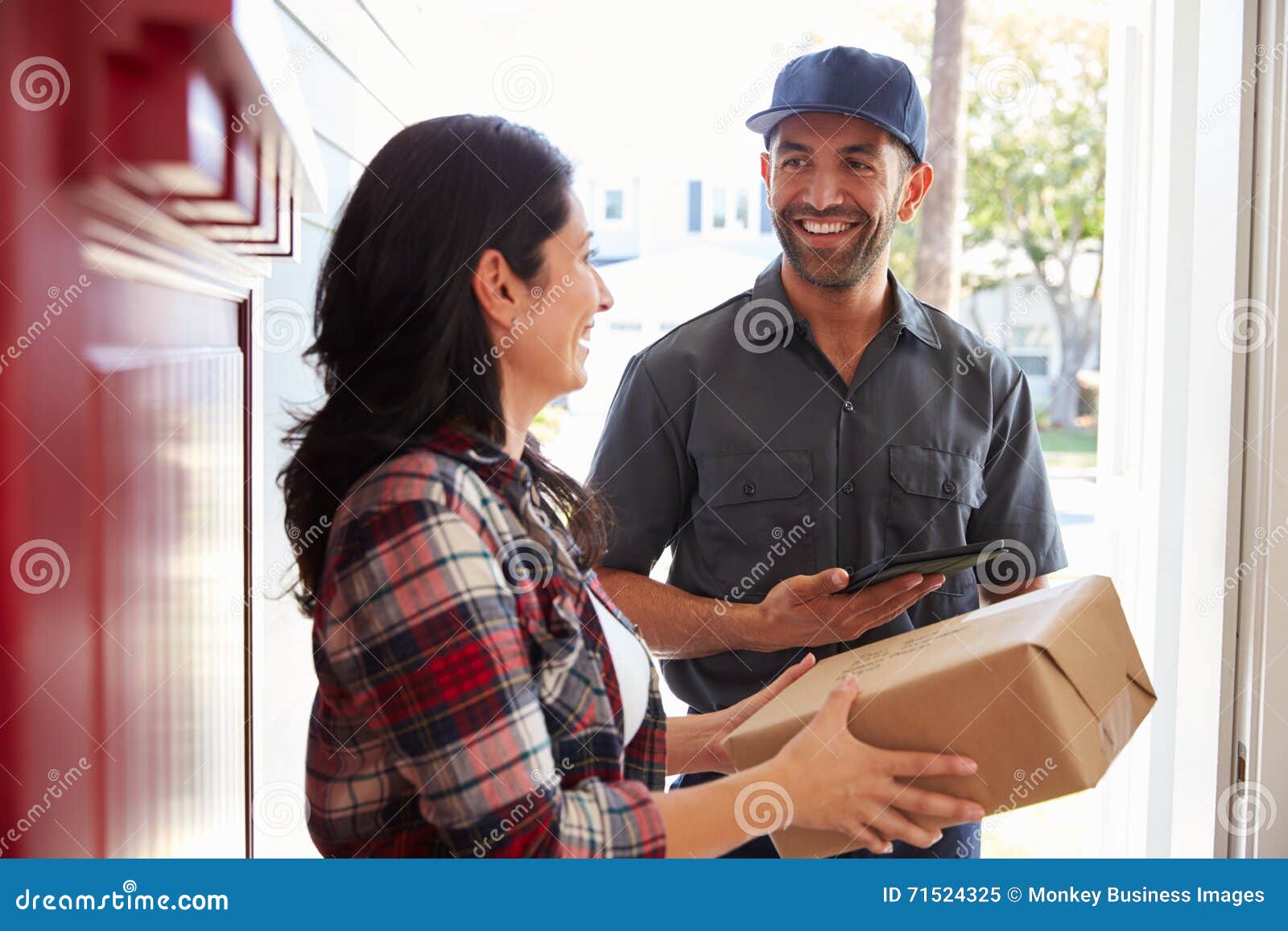 Woman Receiving Package from Courier at Home Stock Image Image of signature, female 71524325