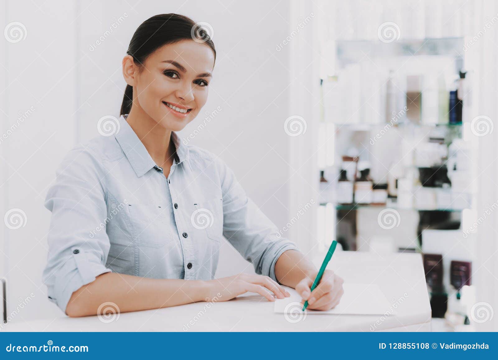 Woman Receptionist In Workplace In Beauty Salon Stock Photo