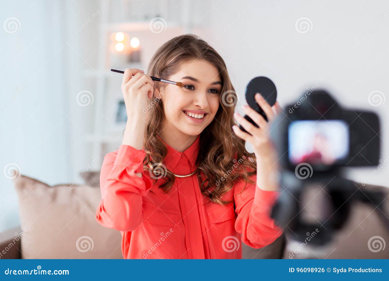 Woman Recording Eye Makeup Tutorial Video At Home Stock Photo