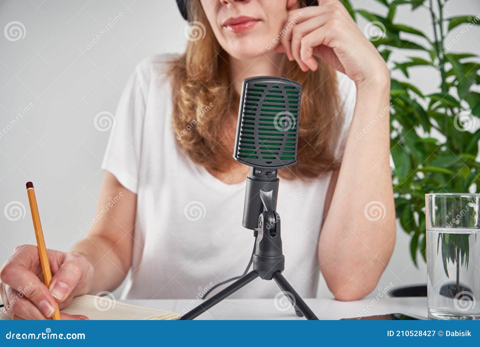 Woman Recording Online Podcast at Home. Microphone on Table. Home