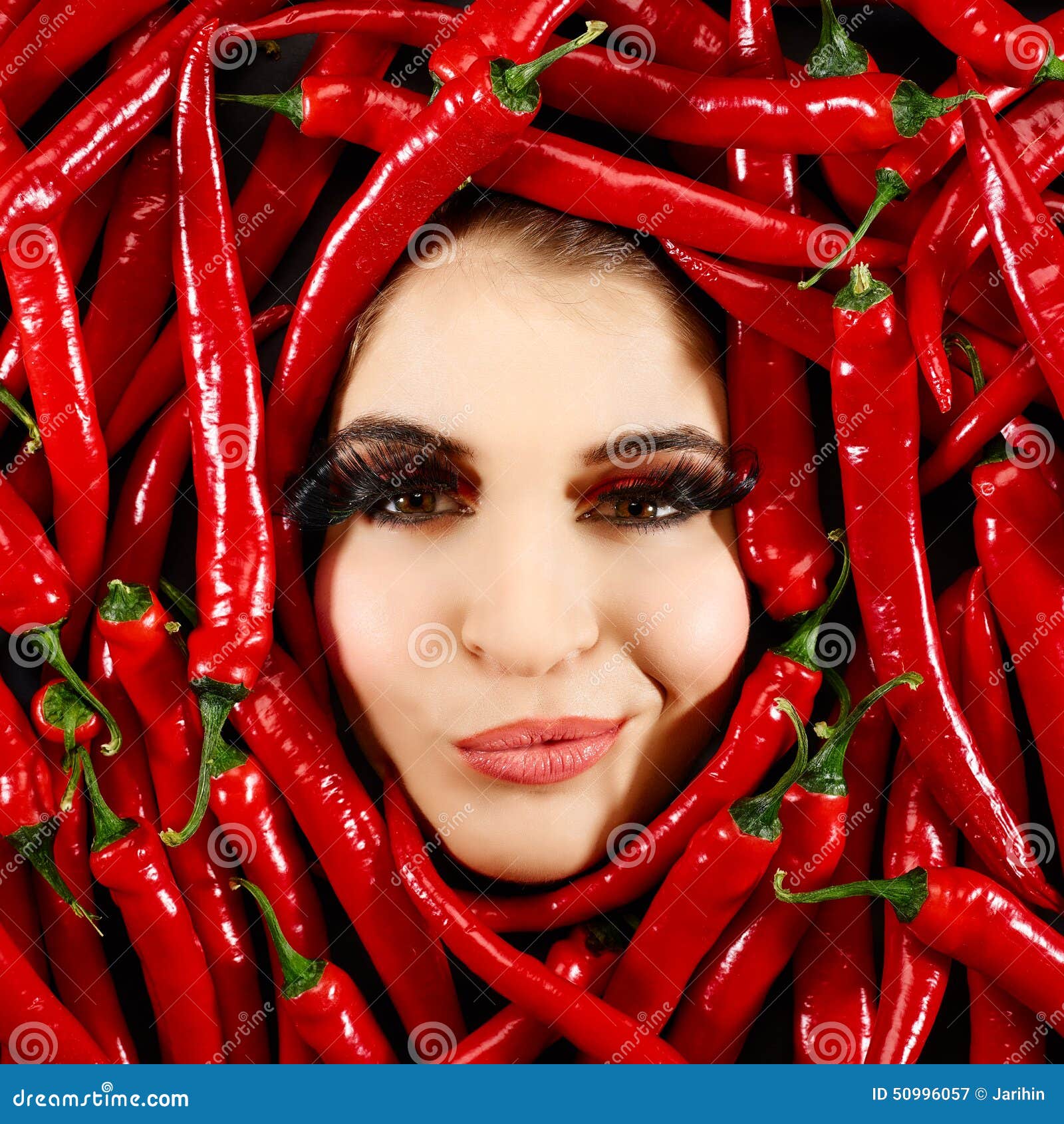 Woman and red chili pepper stock image. Image of eatable 50996057