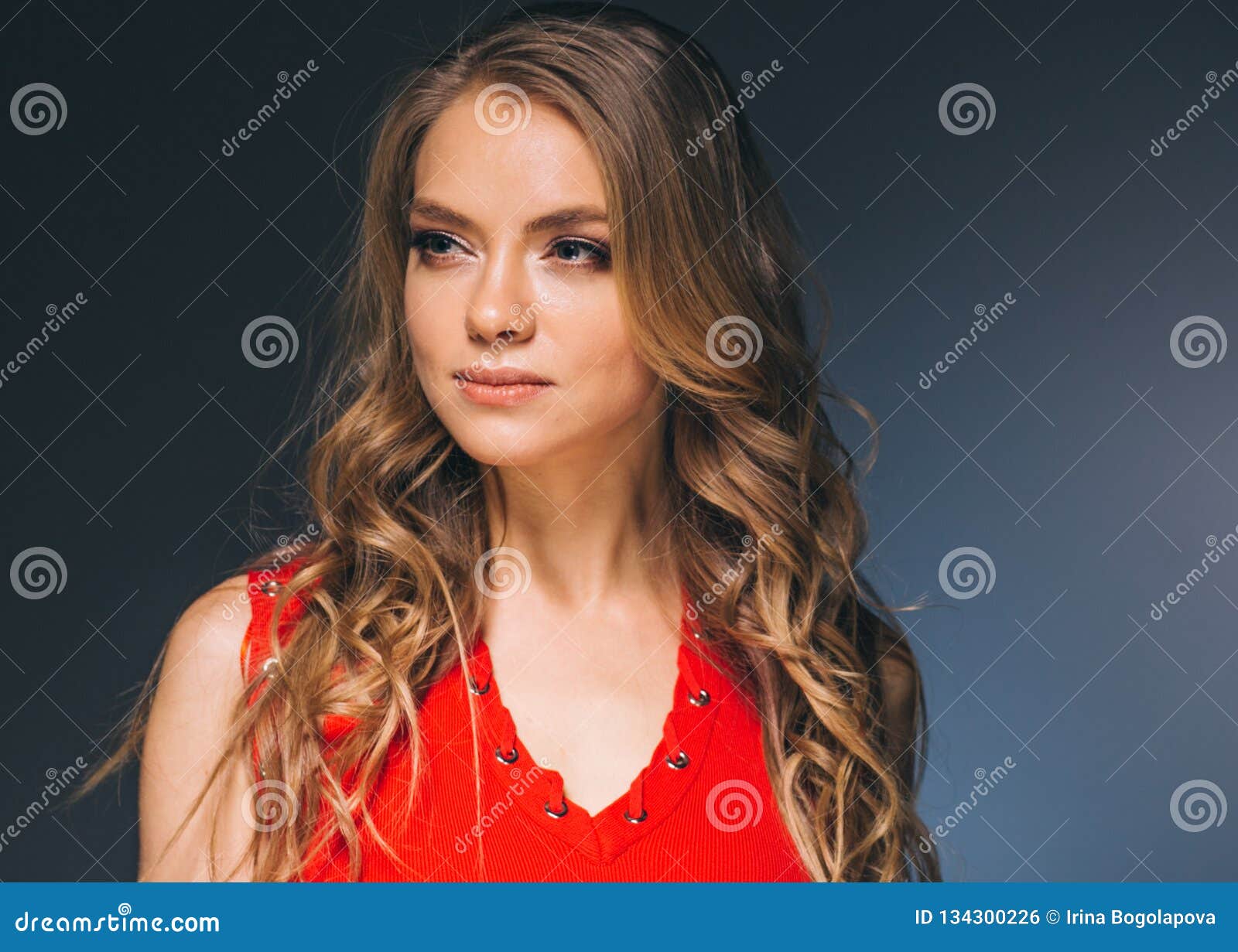 Woman in Red Dress with Long Blonde Hair Stock Photo - Image of chest ...