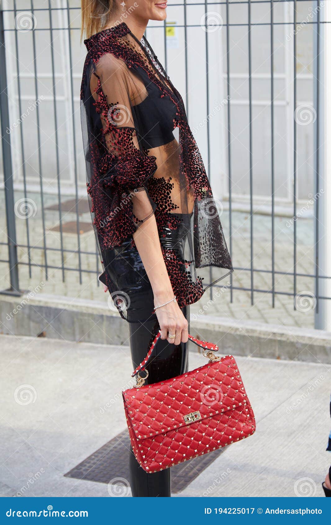 Woman with Red Leather Valentino Bag with Golden Studs before Prada Fashion  Show, Milan Fashion Editorial Photography - Image of show, illustrative:  194225017