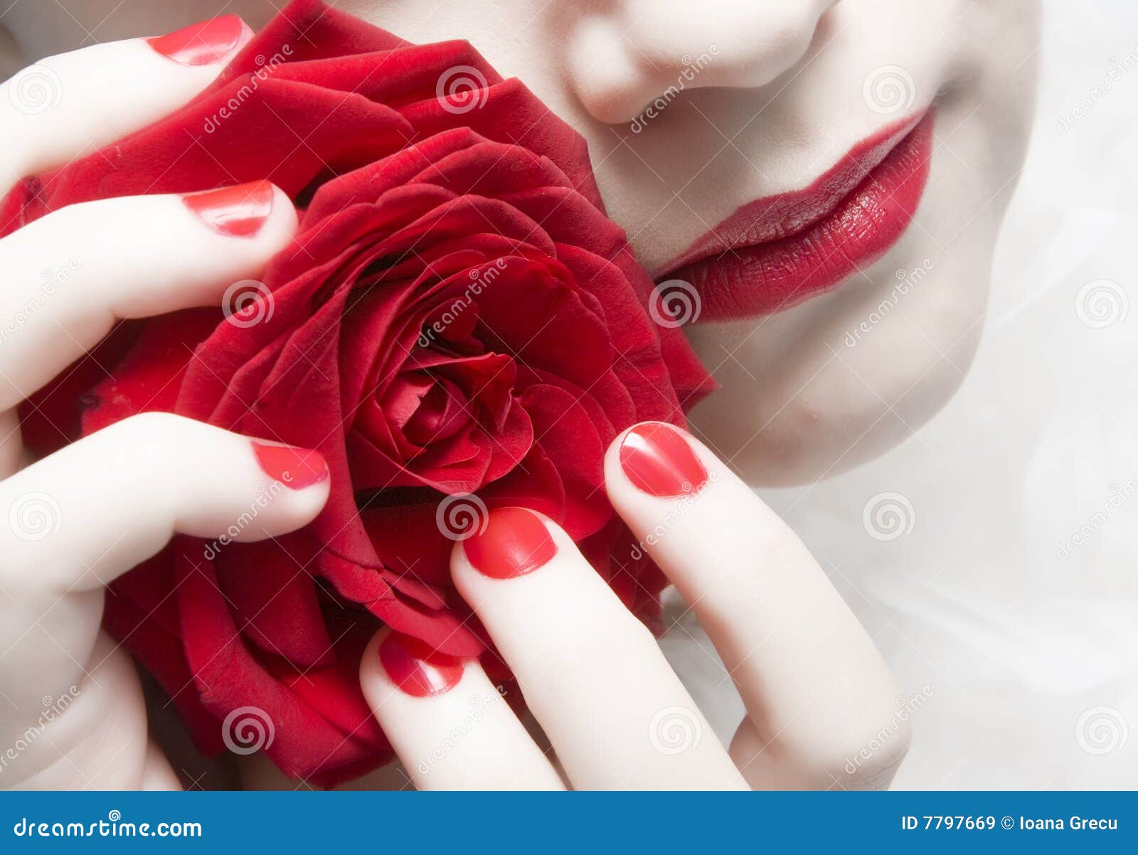 woman with red lips, nails and rose