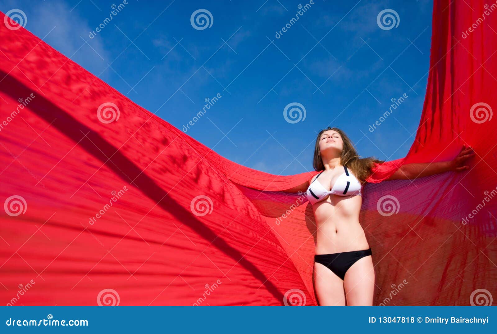 woman with red material and nature