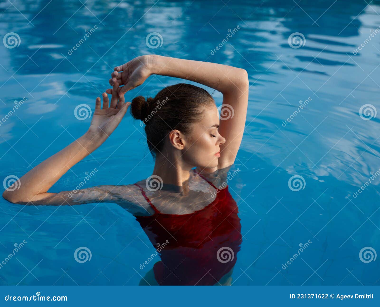 Woman In Red Swimsuit In The Pool Closed Eyes Rest Gesture With Hands