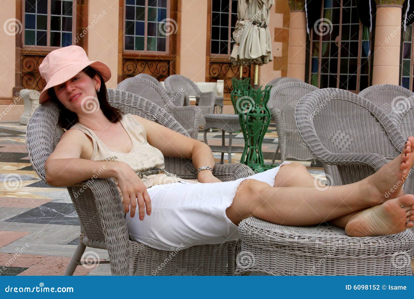 Woman relaxing on a chair stock photo. Image of chair - 6098152