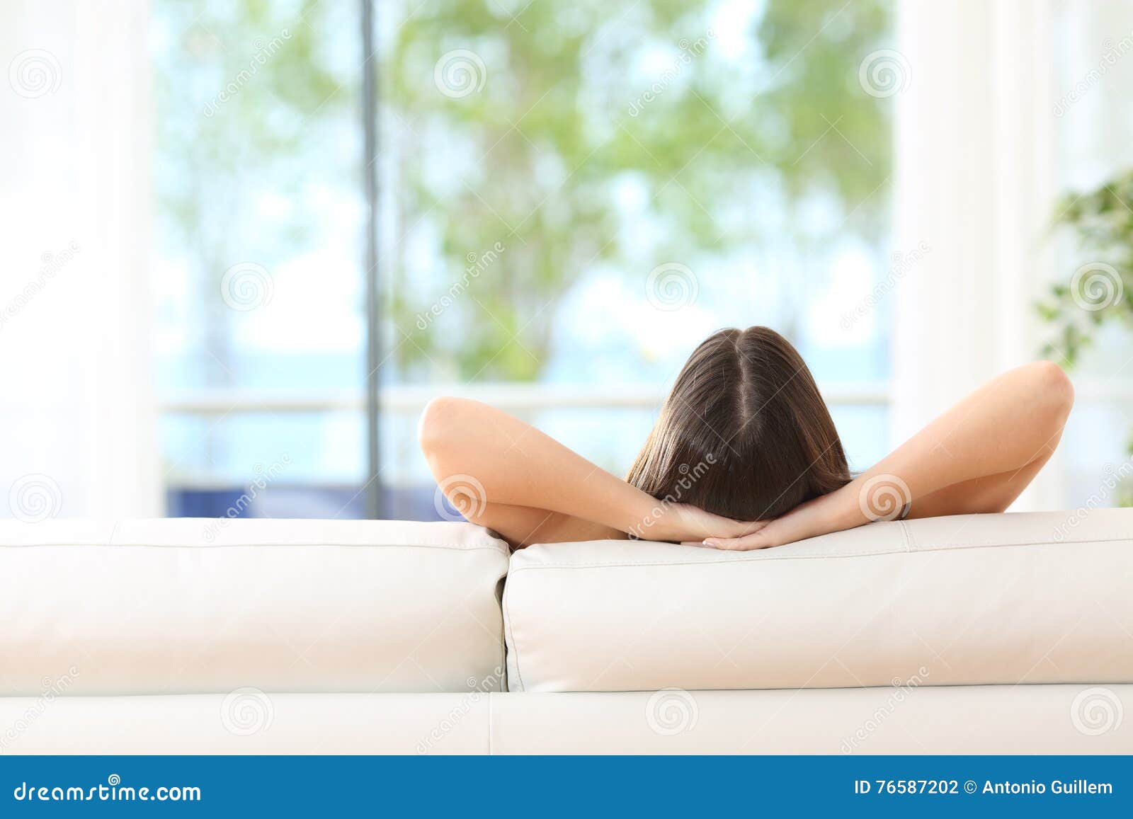 woman relaxing on a couch at home